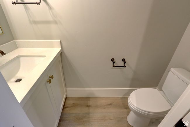 Bathroom featuring vanity and wood finished floors | Image 7