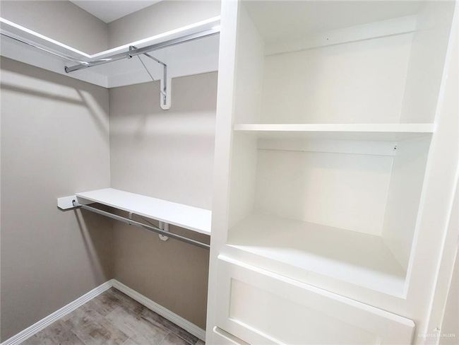 View of spacious closet | Image 16