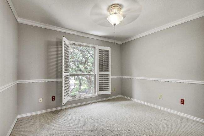 one of 3 secondary bedrooms upstairs with new paint carpet. All feature plantation shutters | Image 25