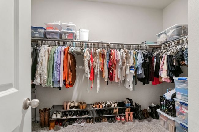 Large walk-in closet for primary bedroom. | Image 14