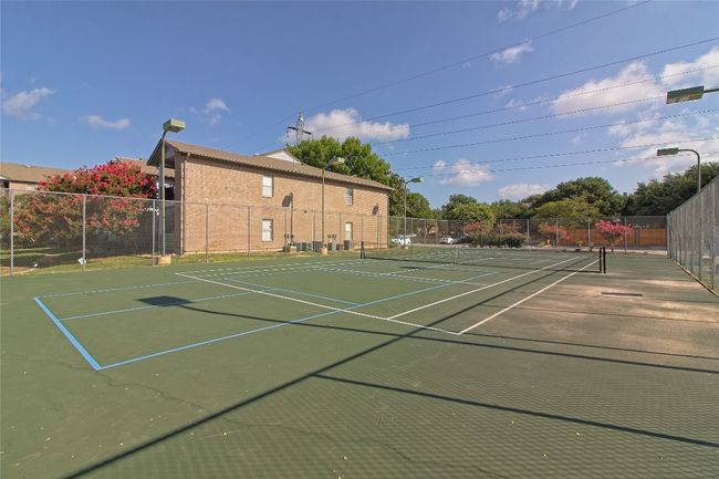 View of tennis court with community basketball court | Image 9