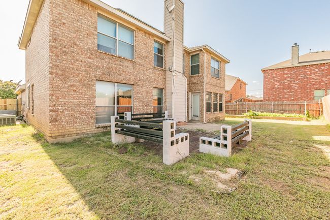 Back of house with a chimney and brick siding | Image 35