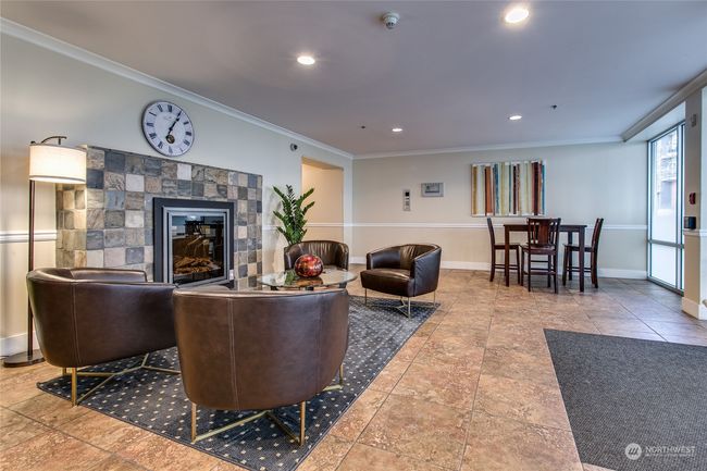 Ground-floor lobby seating area w/ fireplace | Image 16