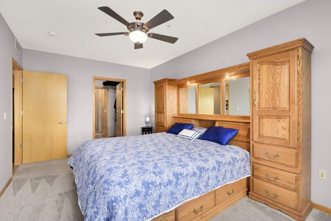 View from the bedroom, through the walk-in closet, to the bathroom and laundry room. The closet provides ideal separation so bedroom occupants are not disturbed by the sound of the shower and laundry room. | Image 13