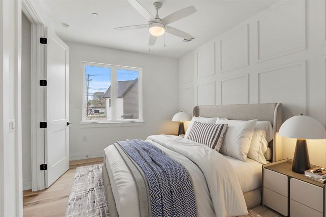 Bedroom featuring light wood-type flooring, baseboards, and ceiling fan | Image 23