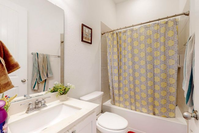Bathroom with shower / bath combo, toilet, and vanity | Image 24