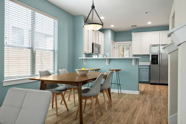 The dining alcove is perfectly positioned just off the kitchen and living room, creating a seamless flow for both everyday meals and casual entertaining | Image 9
