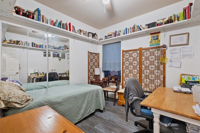 Two additional bedrooms with large closets share a perfectly placed second full bath in the hallway. | Image 28