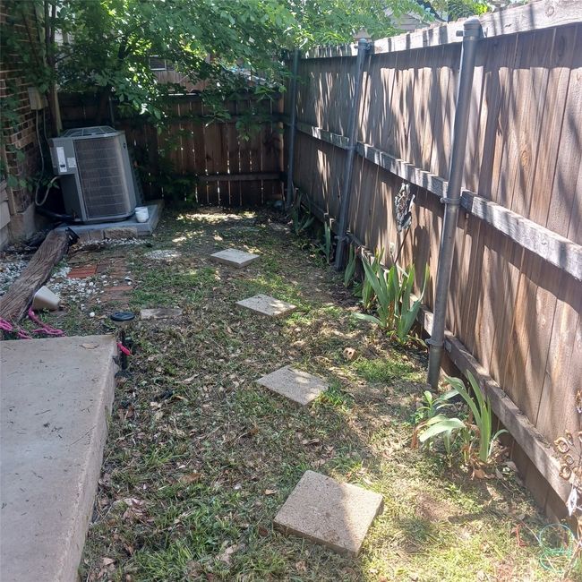 View of yard featuring a fenced backyard and cooling unit | Image 14