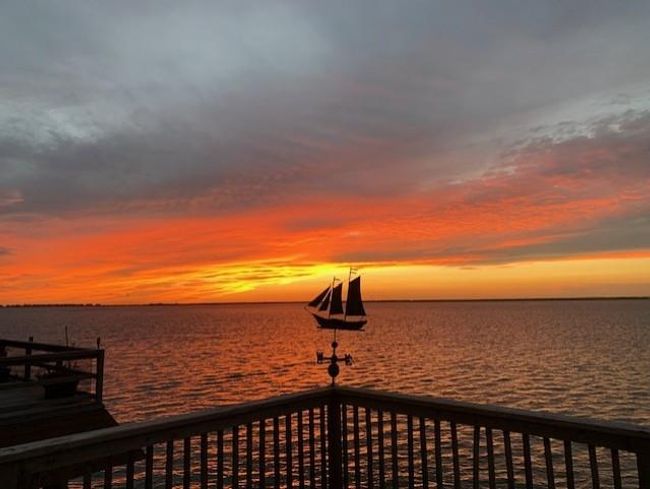 The deck becomes your front-row seat to the day’s last light show. As the sun dips below the horizon, the warm tones light up the water — a peaceful scene that’s all yours to enjoy. | Image 48