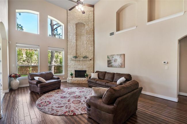The distinguished oversized family room has countless architectural charms and a marvelous view of the enchanting backyard. | Image 16