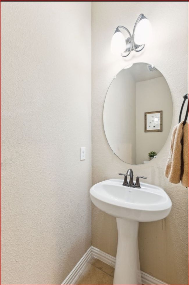 Bathroom featuring tile patterned flooring and a sink | Image 7