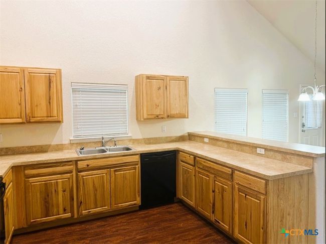 Beautiful and cozy kitchen, with great cainet space to enjoy all year. | Image 11