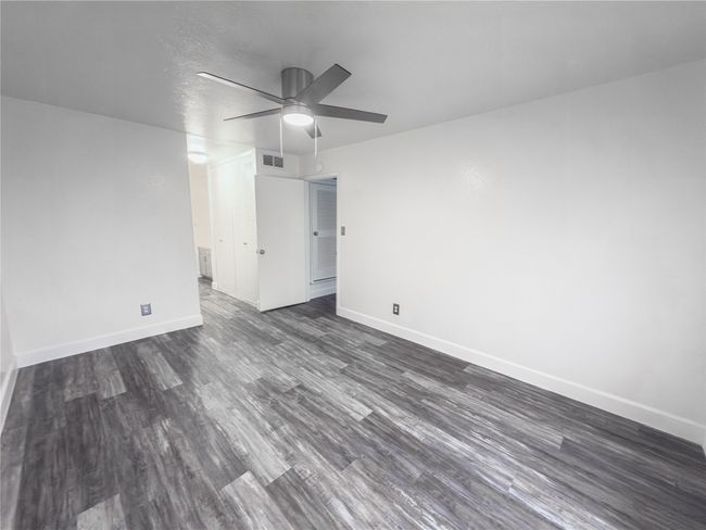 Unfurnished room featuring ceiling fan and dark hardwood / wood-style floors | Image 10