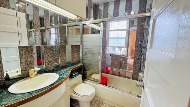 Full bath featuring combined bath / shower with glass door and vanity | Image 7