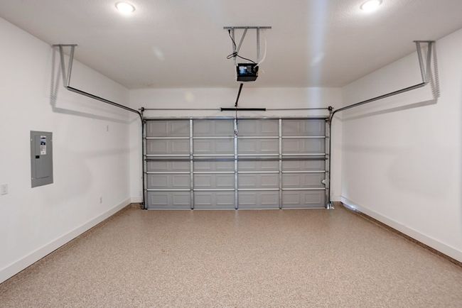 Garage featuring epoxy flooring | Image 32