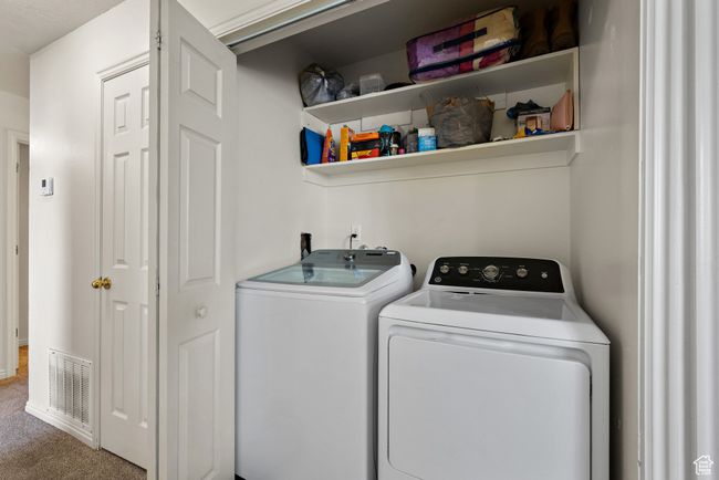 Laundry area with washer and dryer and carpet flooring | Image 20