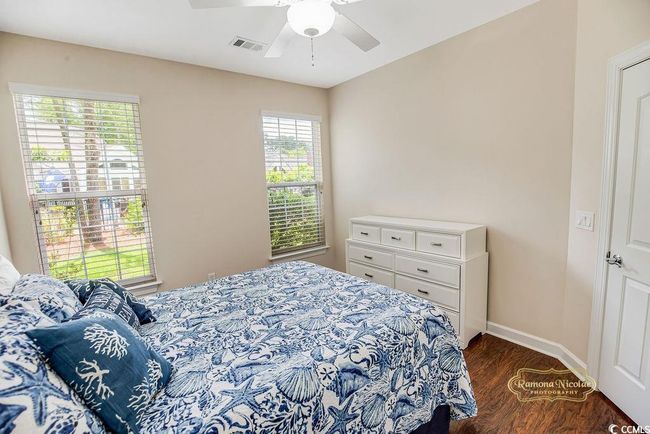 Bedroom featuring dark wood-style floors and a ceiling fan | Image 18