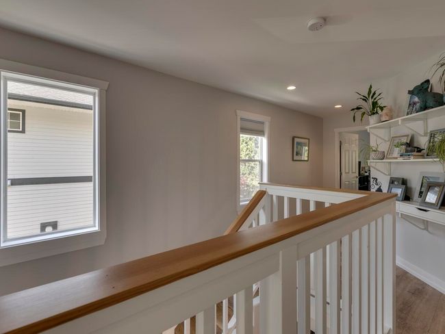 Hall featuring recessed lighting, dark wood finished floors, and an upstairs landing | Image 27