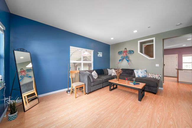 Living area with baseboards, wood finished floors, and recessed lighting | Image 25