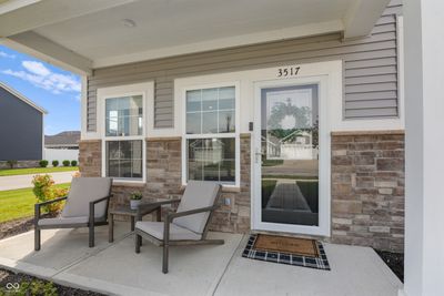 So much sunlight shines into this end unit with open concept great room/dining/kitchen | Image 2