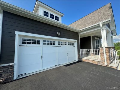 View of front of home with a porch and a garage | Image 3