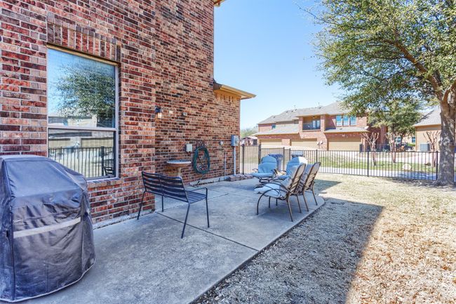 View of patio featuring grilling area and fence | Image 34