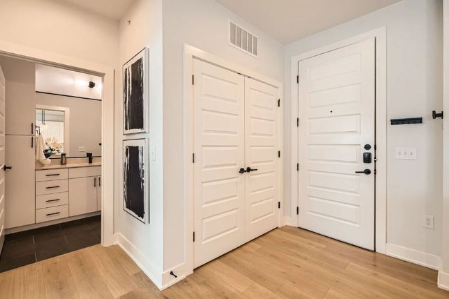 Entrance foyer featuring light wood-style flooring and baseboards | Image 4