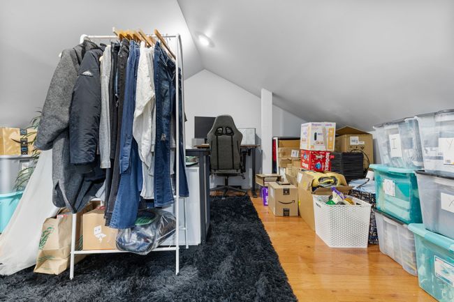Loft area, from wall to wall this loft is 14'8" wide by 12'8" deep. Even with the storage bins here there is still plenty of room to move around and work. | Image 38