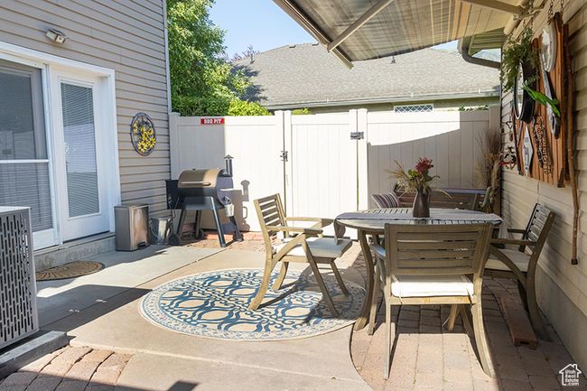 Fenced backyard featuring outdoor dining space, a patio area, and grilling area | Image 22