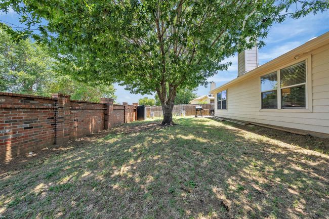 View of fenced backyard | Image 20