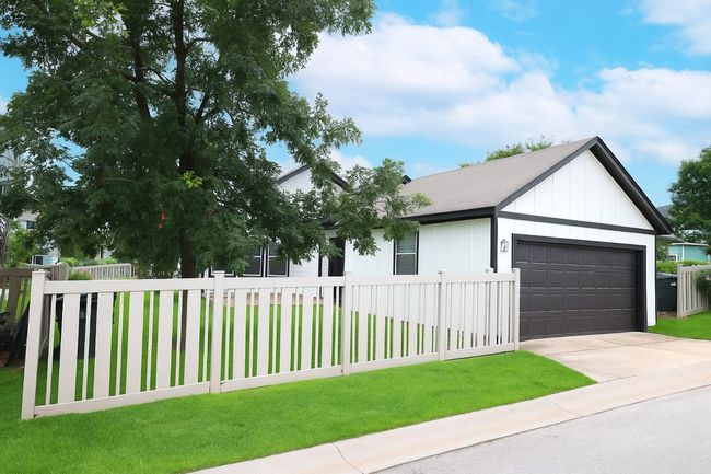 Outside, enjoy a private backyard perfect for relaxing or hosting BBQs. | Image 17
