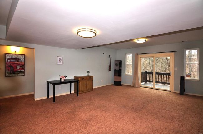 Sliding glass door to lower level deck off family room/rec area. | Image 27