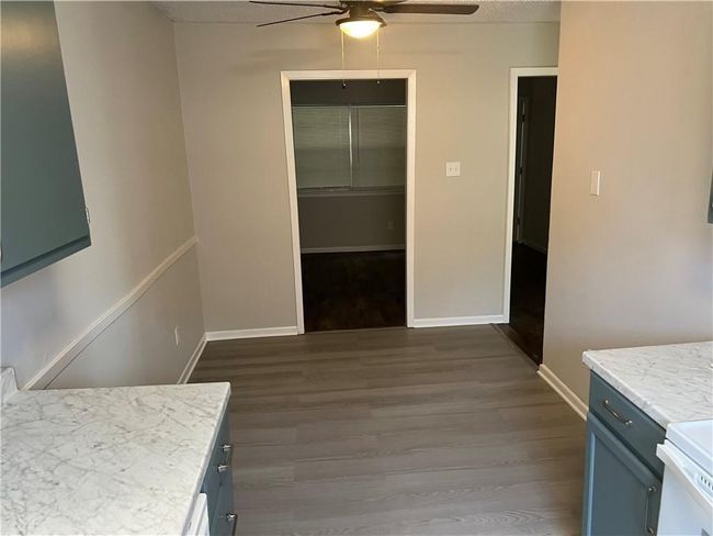 Bedroom featuring wood finished floors and ceiling fan | Image 8