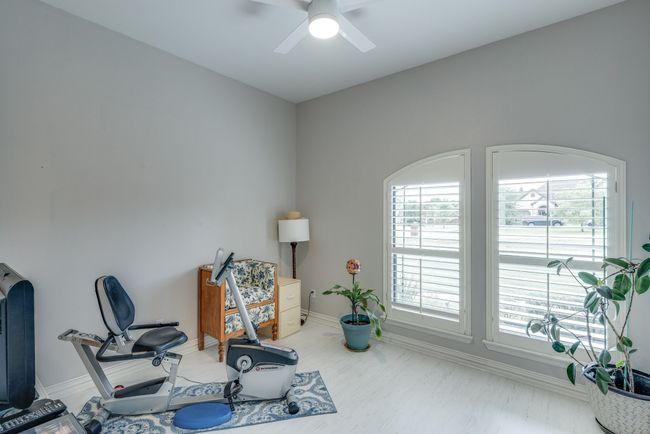 Bedroom, ceiling fan, walk-in closet with built-ins | Image 25