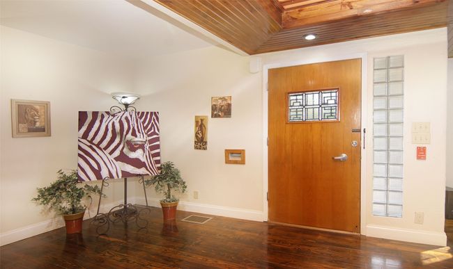 Come in and be amazed at the inviting warm woods and interesting features! | Image 5
