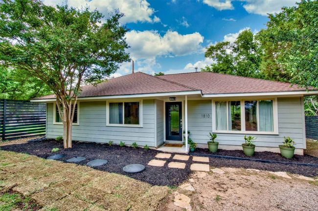 Ranch-style house featuring fence and roof with shingles | Image 17