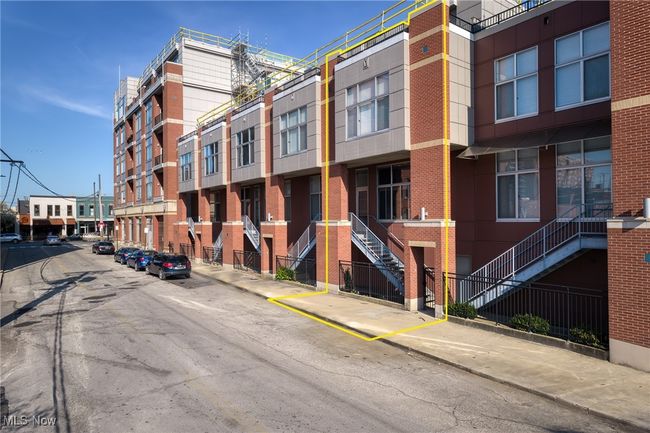View of property with uncovered parking and stairs | Image 40