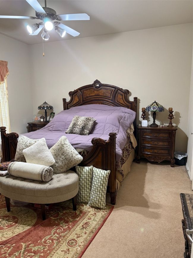 Bedroom with light carpet and ceiling fan | Image 20