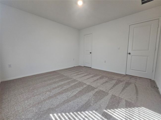 Empty room featuring visible vents, baseboards, and carpet floors | Image 24