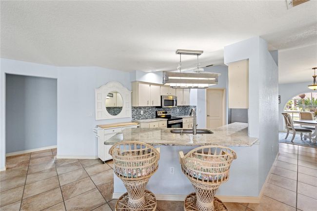 12950 Sw Pembroke Cir S, House other with 3 bedrooms, 2 bathrooms and null parking in LAKE SUZY FL | Image 25