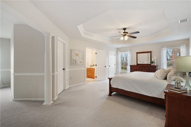 Massive owners suite is the ultimate retreat complete with tray ceiling, double walk in closets, and sitting room. | Image 13