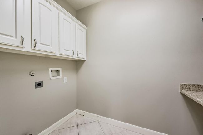 Laundry room next to 1st bathroom | Image 13