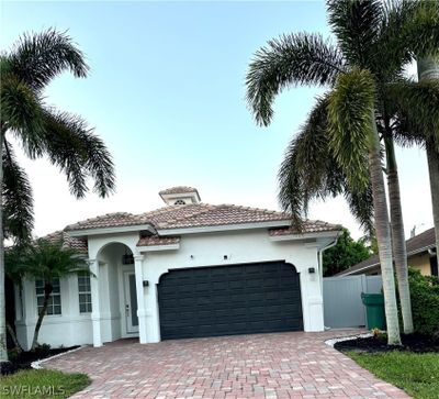 Mediterranean / spanish home featuring a​​‌​​​​‌​​‌‌​‌‌​​​‌‌​​‌‌​‌​​​​​‌ garage | Image 1