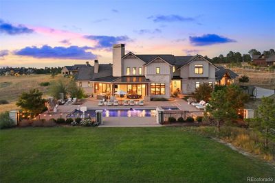 Spectacular outdoor living with saltwater pool, spa, expansive patios with fireplace and fire pit. | Image 2