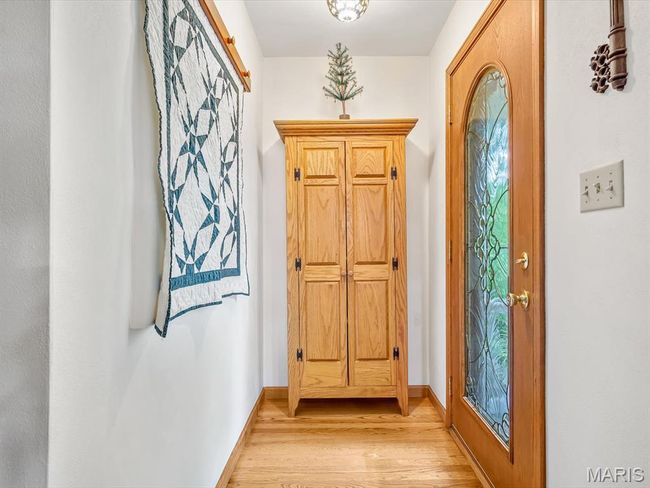 Bathroom with vanity, tile walls, and tile patterned floors | Image 28
