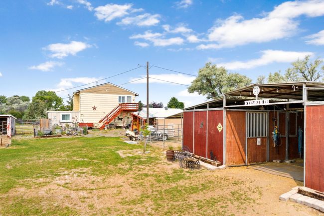 View of yard featuring an outbuilding and an exterior structure | Image 16