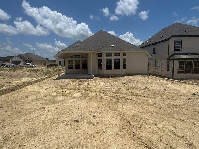 Rear view of house with a patio area | Image 6