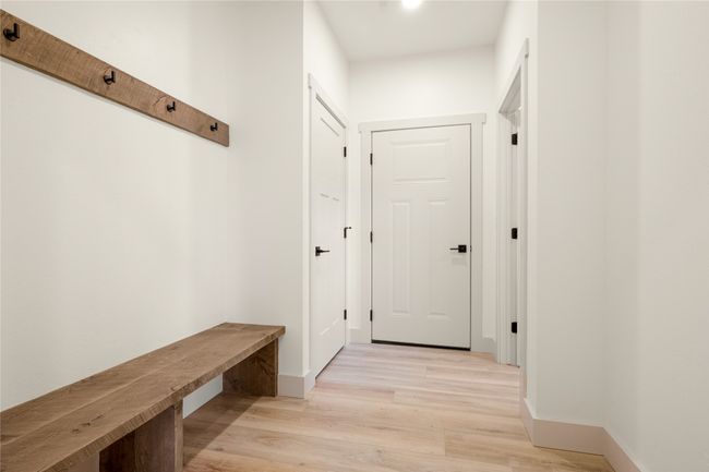 Mudroom featuring light wood finished floors and baseboards | Image 22
