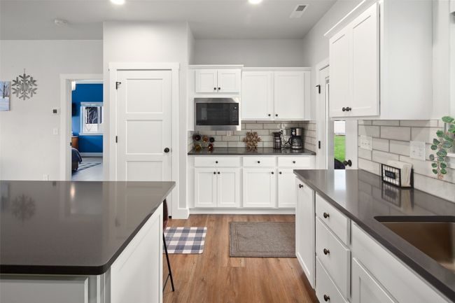 Many cabinets, pantry & bar. | Image 31